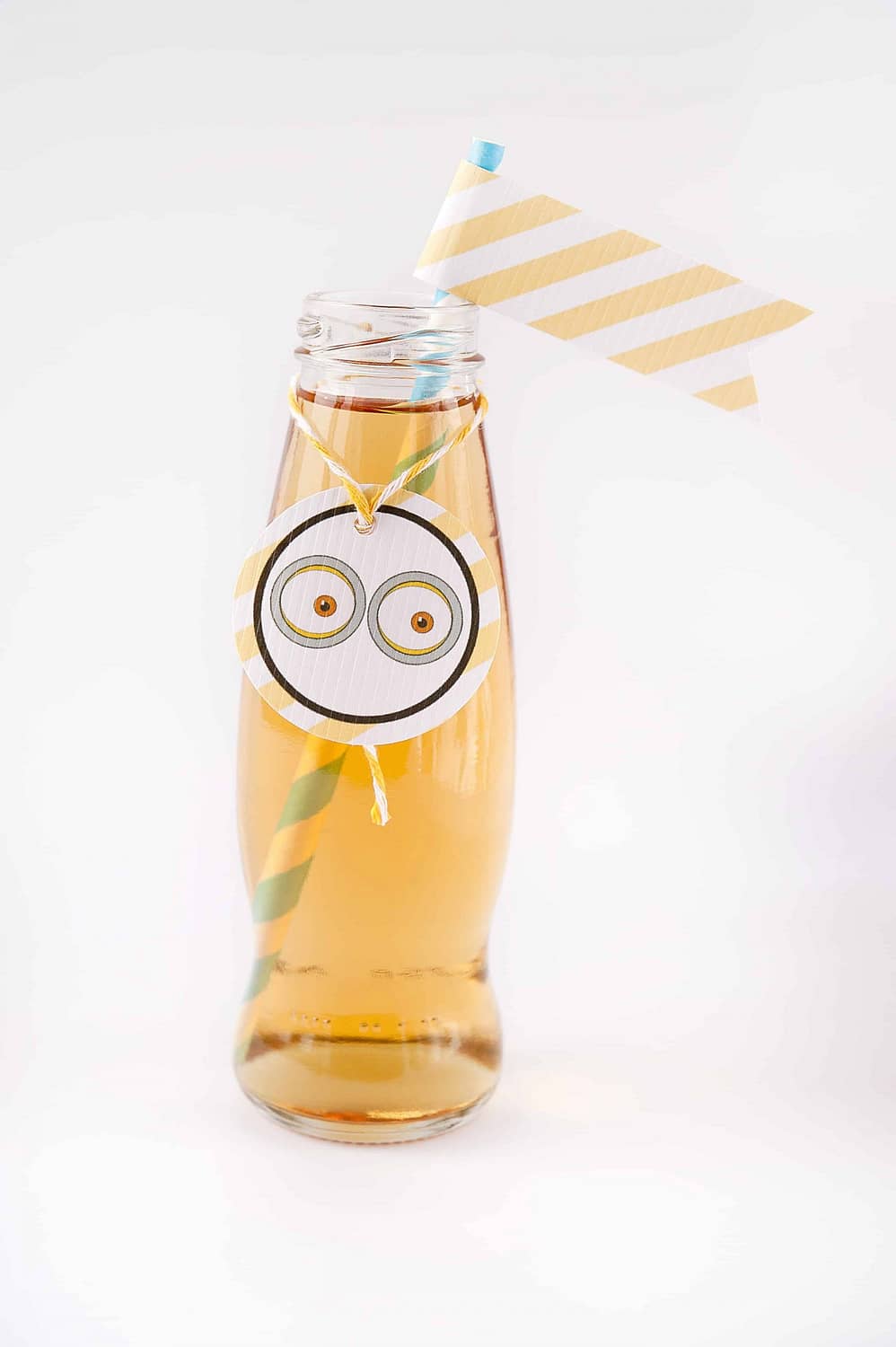 apple juice in a beautiful bottle with eyes and a flag and decorations