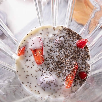 Berries and chia seeds in a glass blender