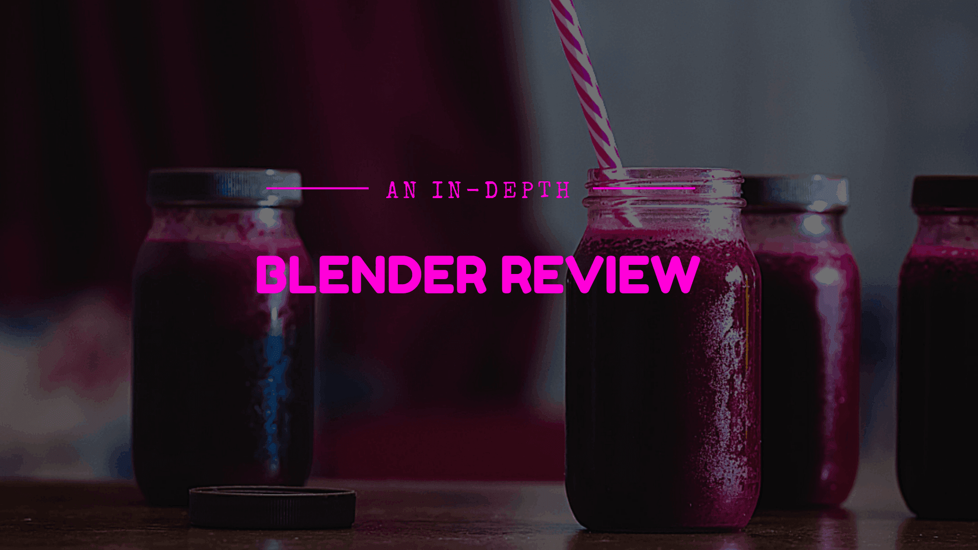 Image of mason jars filled with red smoothies with words: In-Depth Blender Review above the image