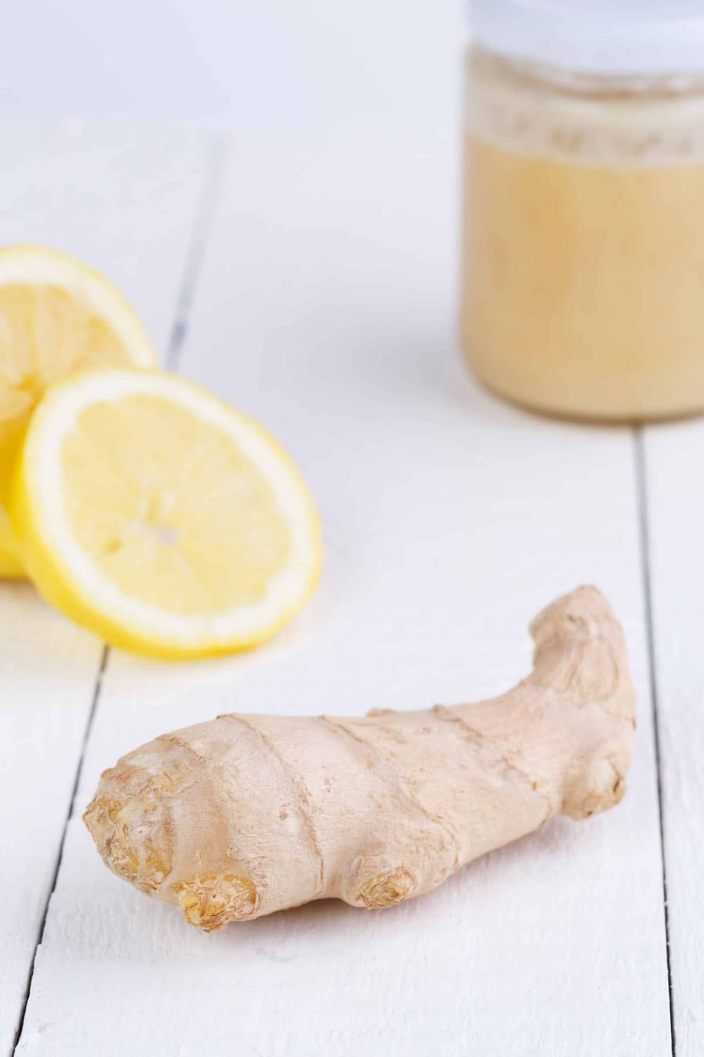 ginger and lemon on a white wooden table